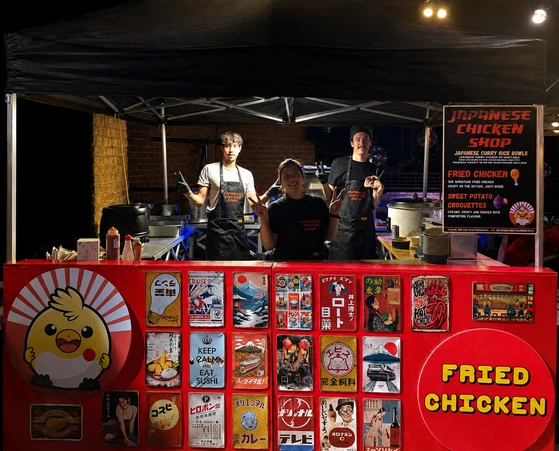 Japanese Chicken Shop team serving from an event stall